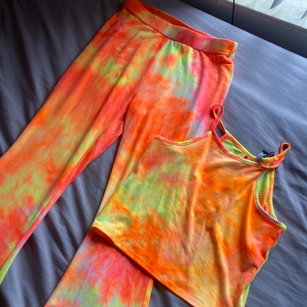 Item is a outfit colors orange yellow a pink peach color